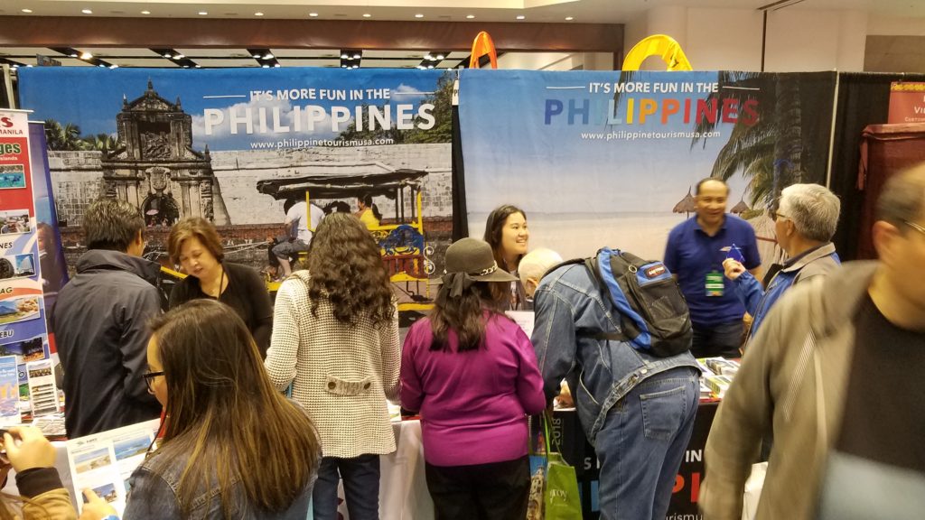<photo> Non-stop inquiries, promo materials distribution and sign-ups at the Philippine tourism booth during the second day of the show